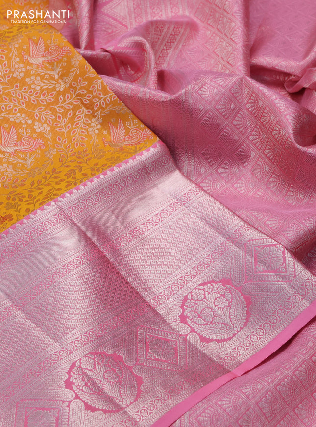 Pure kanchipuram silk saree mango yellow and light pink with allover silver zari woven brocade weaves and long silver zari woven border