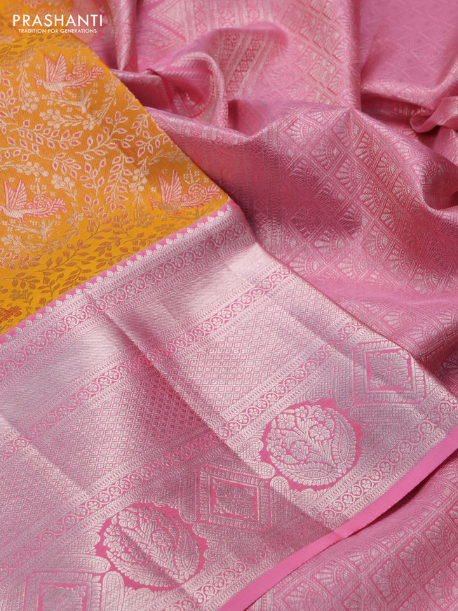 Pure kanchipuram silk saree mango yellow and light pink with allover silver zari woven brocade weaves and long silver zari woven border