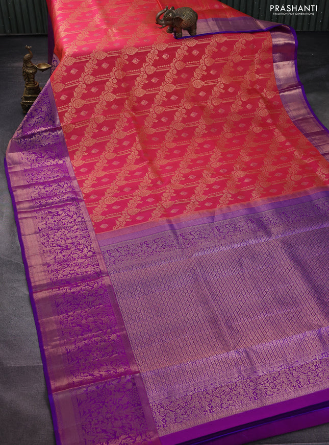 Pure kanchipuram silk saree dual shade of pinkish orange and purple with allover zari woven brocade weaves and rich zari woven border