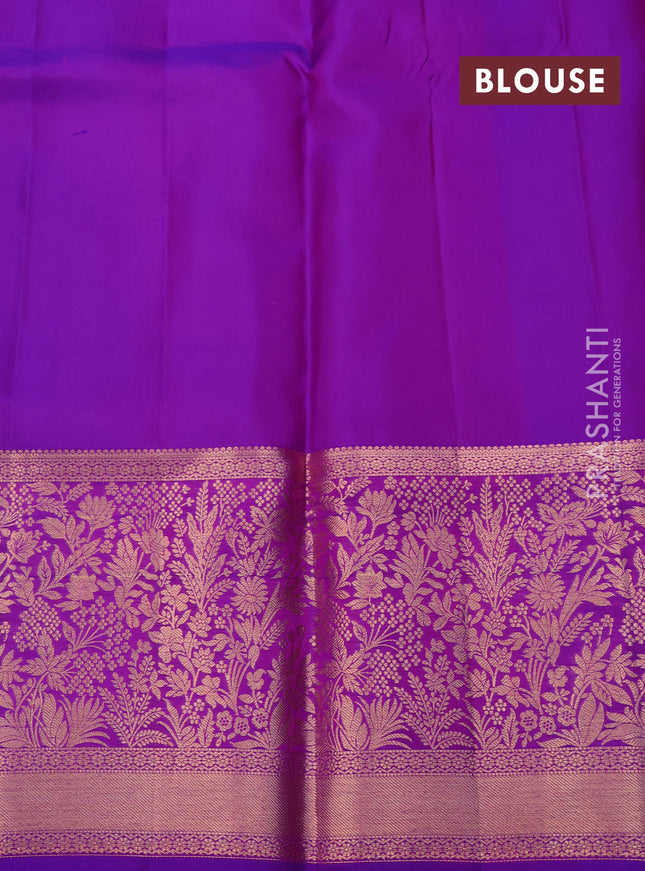 Pure kanchipuram silk saree dual shade of pinkish orange and purple with allover zari woven brocade weaves and rich zari woven border