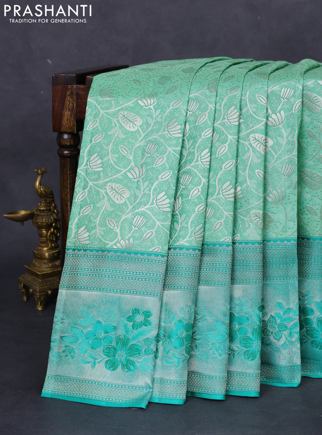 Pure kanchipuram silk saree pastel green and teal green shade with allover silver zari woven brocade weaves and zari woven floral design border