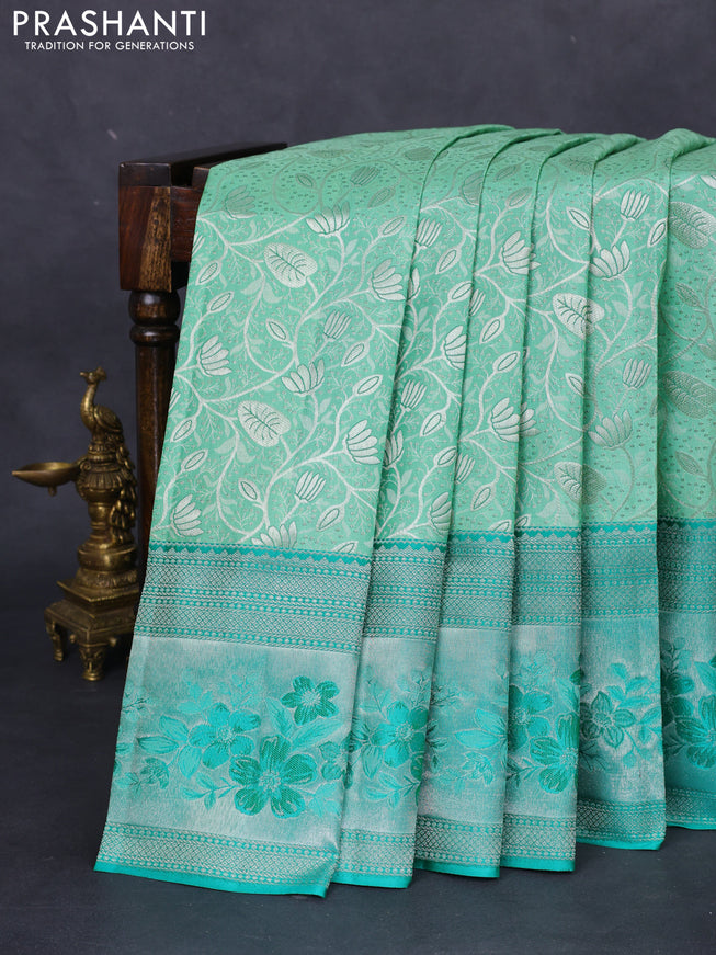 Pure kanchipuram silk saree pastel green and teal green shade with allover silver zari woven brocade weaves and zari woven floral design border