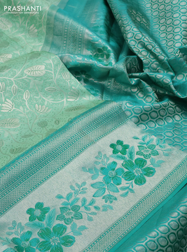 Pure kanchipuram silk saree pastel green and teal green shade with allover silver zari woven brocade weaves and zari woven floral design border