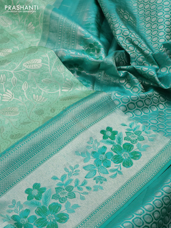 Pure kanchipuram silk saree pastel green and teal green shade with allover silver zari woven brocade weaves and zari woven floral design border