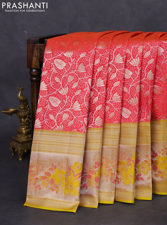 Pure kanchipuram silk saree dual shade of pinkish orange and mustard yellow with allover silver zari woven brocade weaves and zari woven floral design border