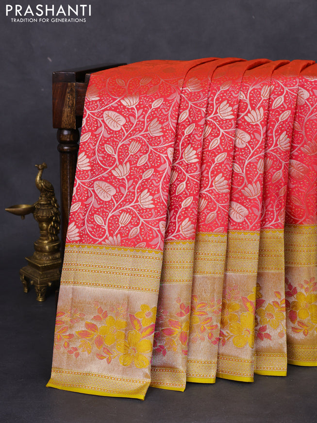 Pure kanchipuram silk saree dual shade of pinkish orange and mustard yellow with allover silver zari woven brocade weaves and zari woven floral design border