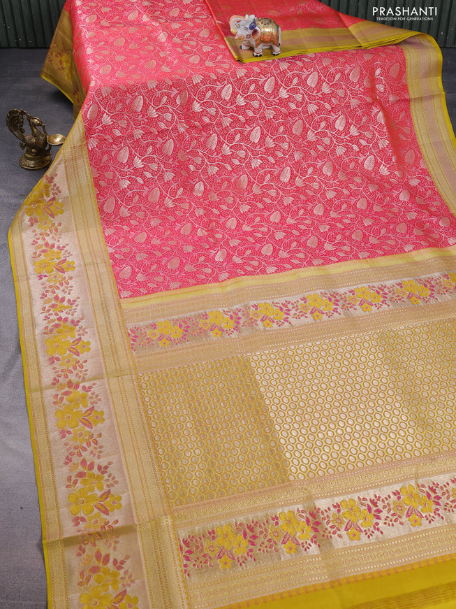 Pure kanchipuram silk saree dual shade of pinkish orange and mustard yellow with allover silver zari woven brocade weaves and zari woven floral design border