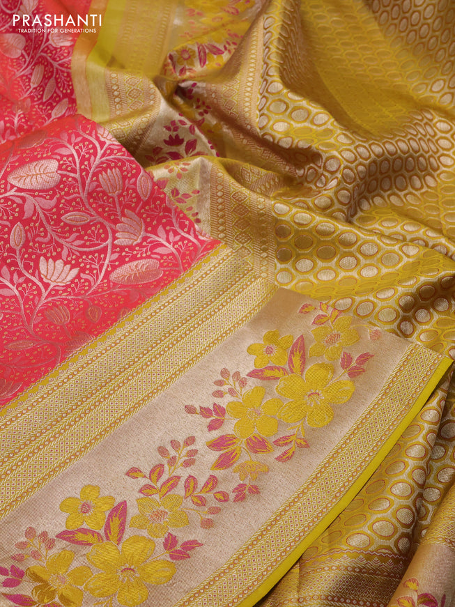 Pure kanchipuram silk saree dual shade of pinkish orange and mustard yellow with allover silver zari woven brocade weaves and zari woven floral design border