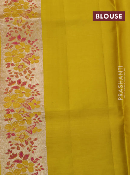 Pure kanchipuram silk saree dual shade of pinkish orange and mustard yellow with allover silver zari woven brocade weaves and zari woven floral design border