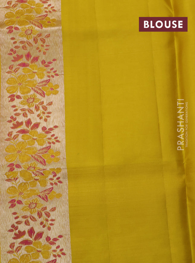 Pure kanchipuram silk saree dual shade of pinkish orange and mustard yellow with allover silver zari woven brocade weaves and zari woven floral design border