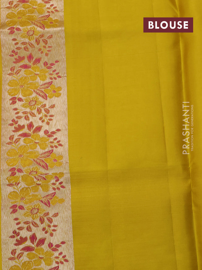Pure kanchipuram silk saree dual shade of pinkish orange and mustard yellow with allover silver zari woven brocade weaves and zari woven floral design border