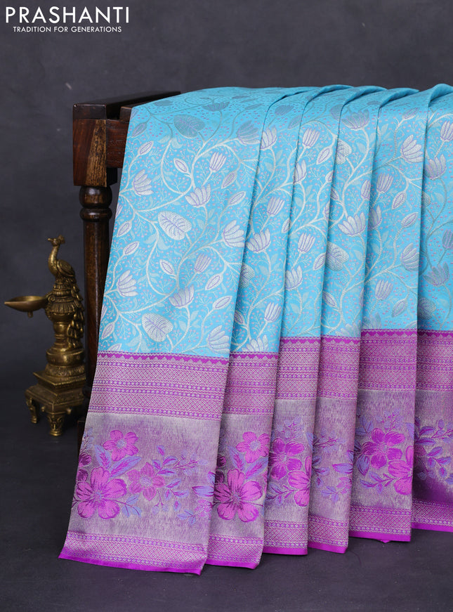 Pure kanchipuram silk saree light blue and purple with allover silver zari woven brocade weaves and zari woven floral design border