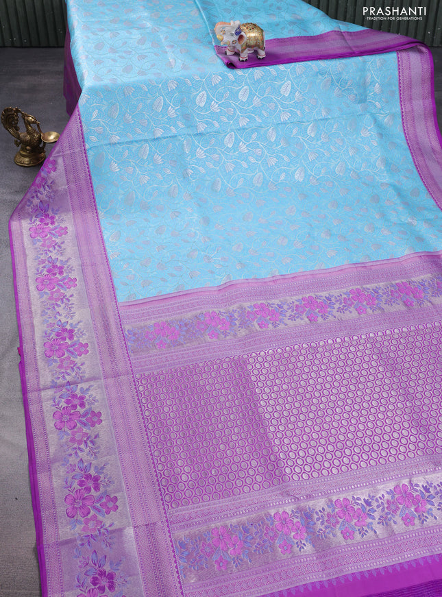 Pure kanchipuram silk saree light blue and purple with allover silver zari woven brocade weaves and zari woven floral design border