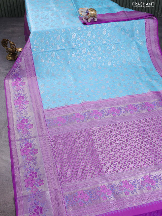 Pure kanchipuram silk saree light blue and purple with allover silver zari woven brocade weaves and zari woven floral design border