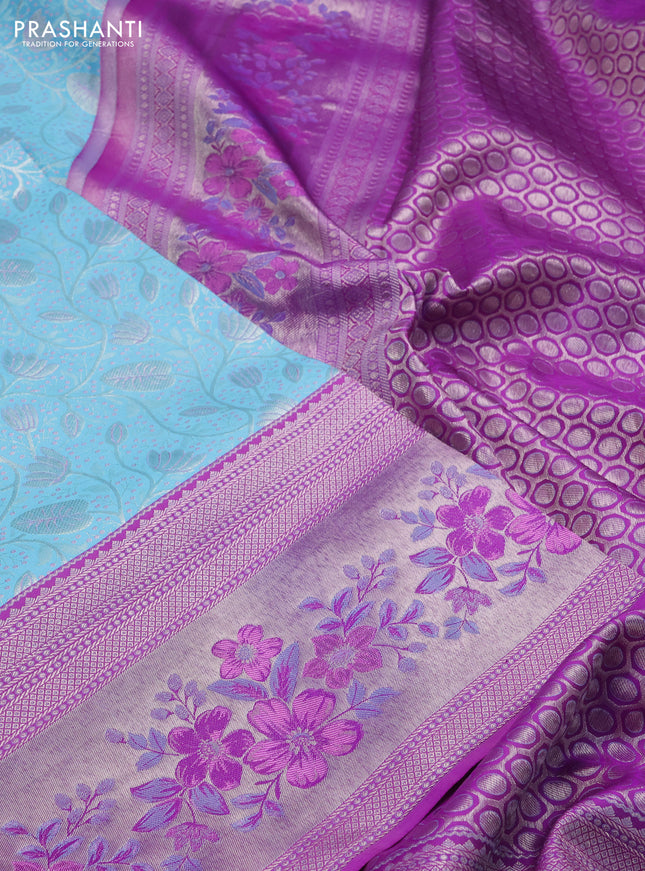 Pure kanchipuram silk saree light blue and purple with allover silver zari woven brocade weaves and zari woven floral design border