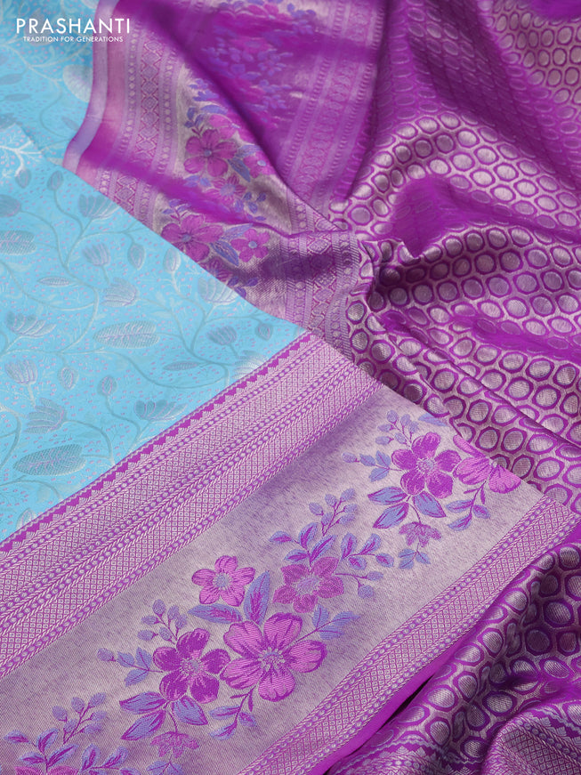 Pure kanchipuram silk saree light blue and purple with allover silver zari woven brocade weaves and zari woven floral design border