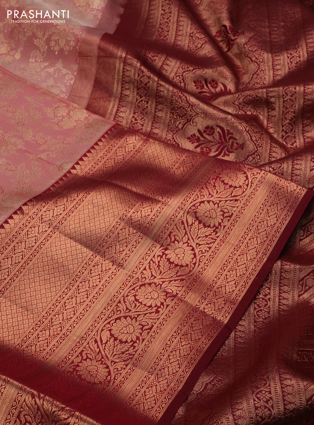 Pure kanchipuram silk saree peach shade and deep maroon with allover zari woven brocade weaves and long copper zari woven border