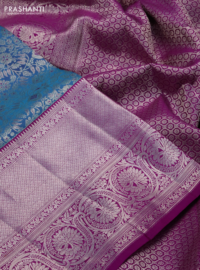 Pure kanchipuram silk saree dual shade of cs blue and purple with allover silver zari woven brocade weaves and silver zari woven border