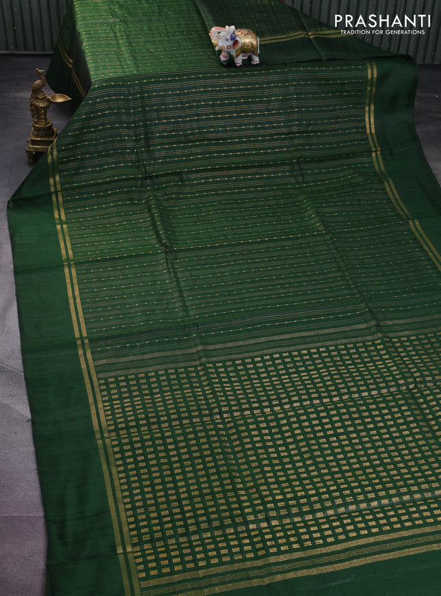 Pure dupion silk saree green with allover zari weaves and zari woven simple border