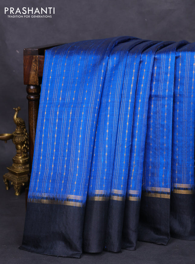 Pure dupion silk saree cs blue and black with allover zari weaves and zari woven simple border