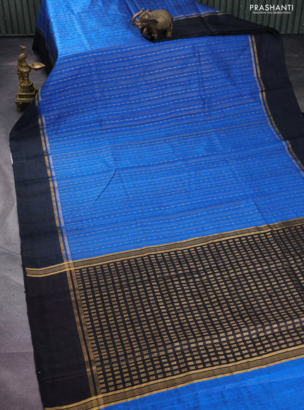 Pure dupion silk saree cs blue and black with allover zari weaves and zari woven simple border