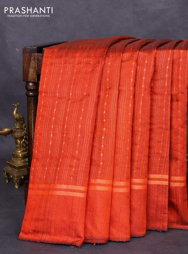 Pure dupion silk saree orange with allover zari weaves and zari woven simple border