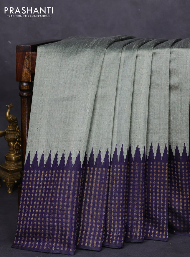 Pure dupion silk saree pastel green and navy blue with plain body and temple design zari butta border