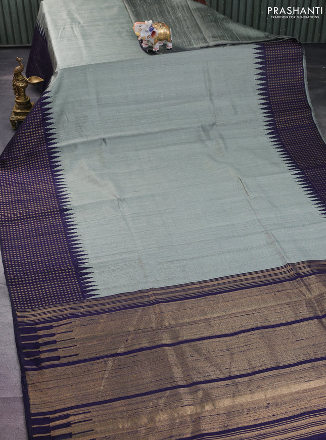 Pure dupion silk saree pastel green and navy blue with plain body and temple design zari butta border