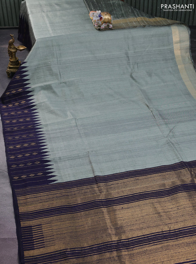 Pure dupion silk saree pastel grey and navy blue with plain body and temple design zari butta border
