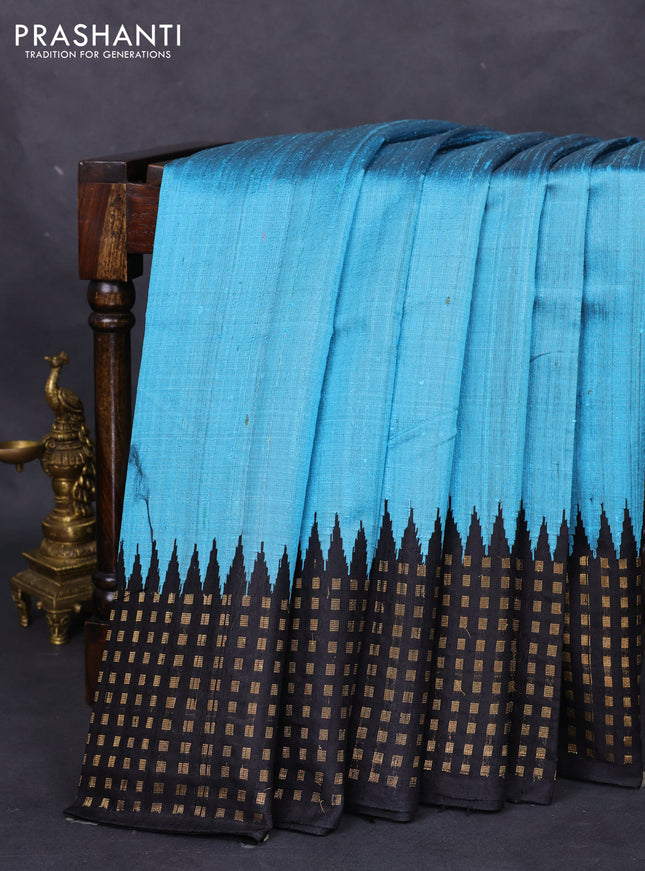 Pure dupion silk saree light blue and black with plain body and temple design zari butta border