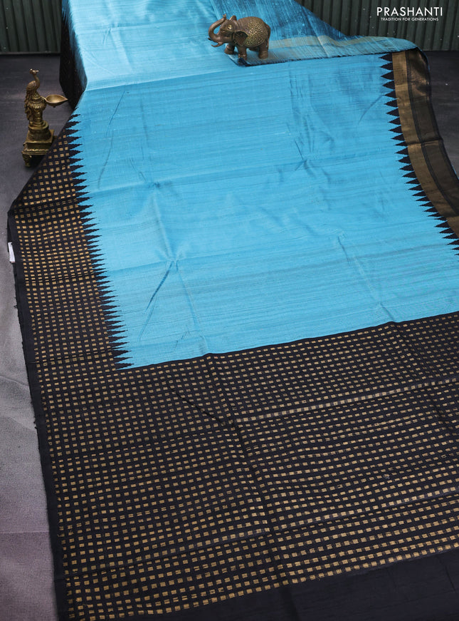 Pure dupion silk saree light blue and black with plain body and temple design zari butta border