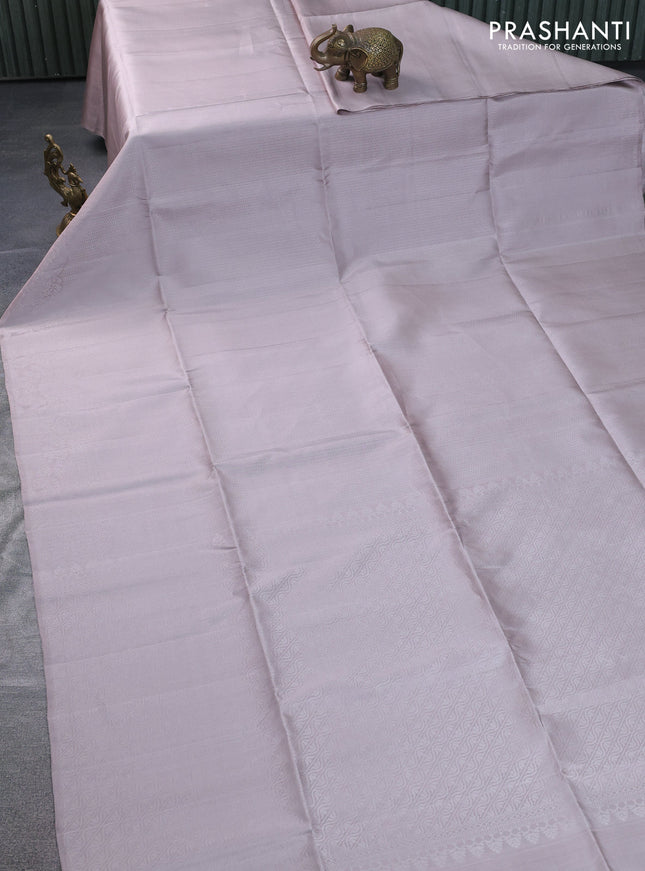 Pure soft silk saree beige with allover silver zari woven brocade weaves and rich silver zari border