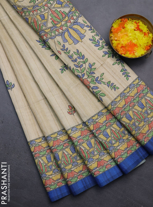 Semi tussar saree beige and blue with madhubani prints and printed border