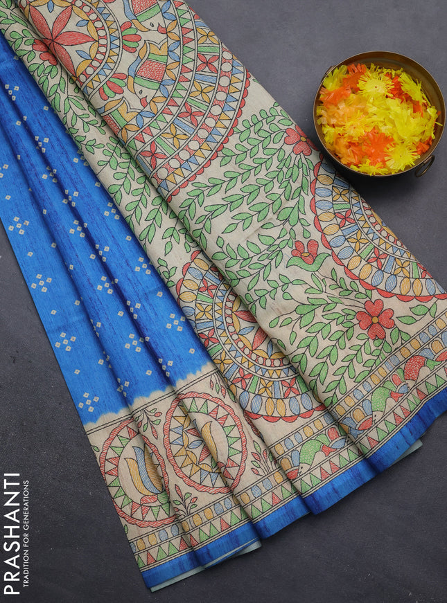 Semi tussar saree cs blue and beige with bandhini butta prints and mandhubani printed pallu