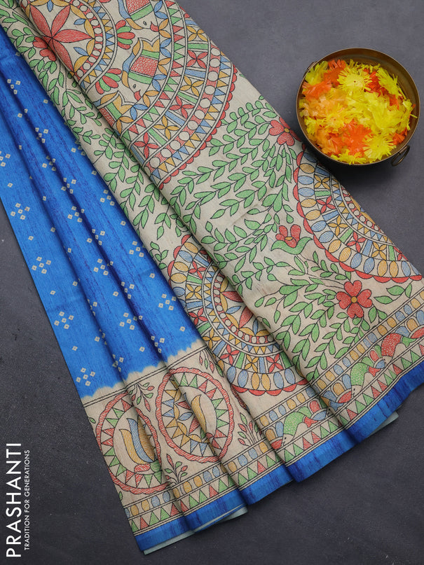 Semi tussar saree cs blue and beige with bandhini butta prints and mandhubani printed pallu
