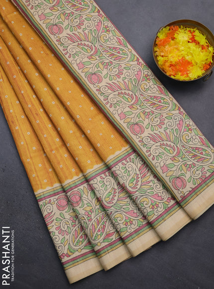 Semi tussar saree mustard yellow and sandal with bandhini butta prints and printed border