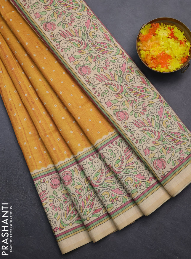 Semi tussar saree mustard yellow and sandal with bandhini butta prints and printed border