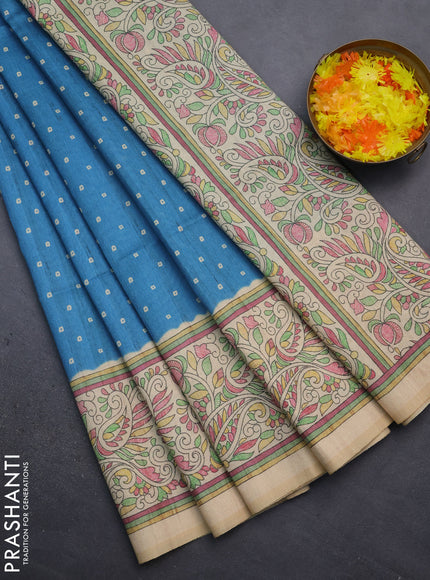 Semi tussar saree cs blue and sandal with bandhini butta prints and printed border