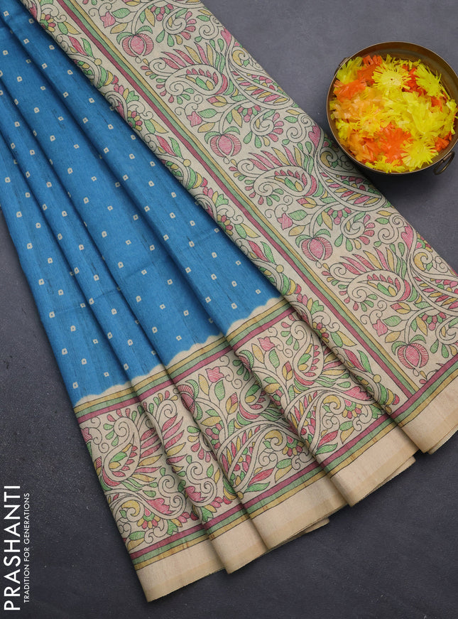 Semi tussar saree cs blue and sandal with bandhini butta prints and printed border