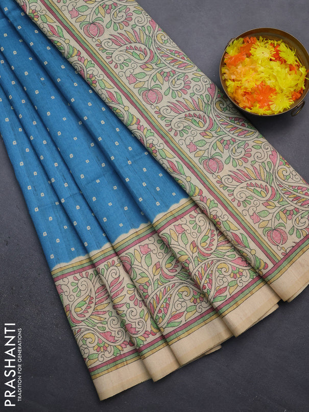Semi tussar saree cs blue and sandal with bandhini butta prints and printed border