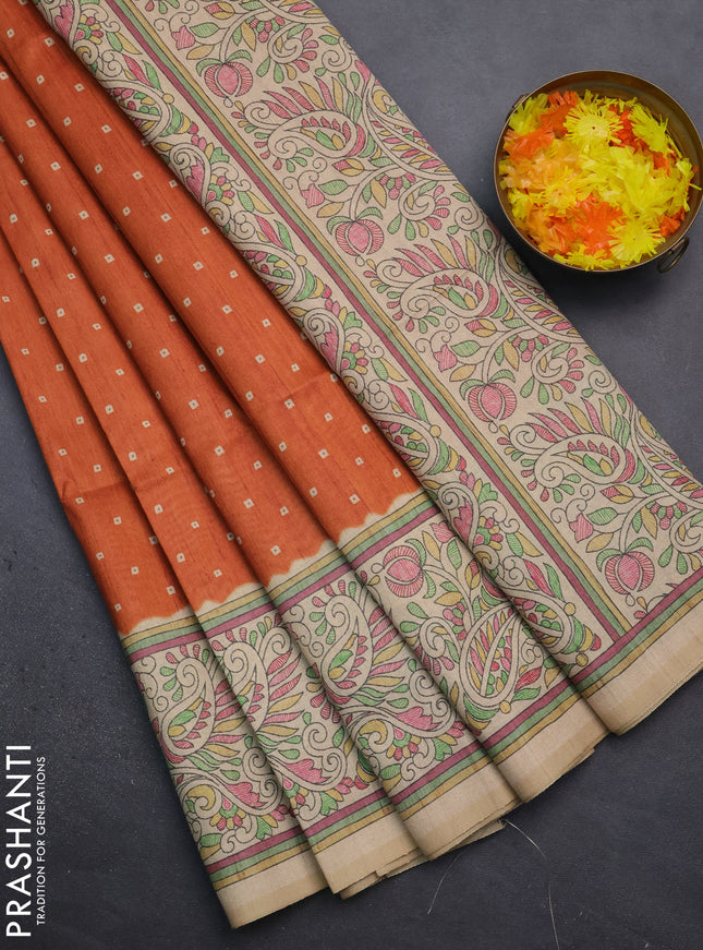 Semi tussar saree orange and sandal with bandhini butta prints and printed border