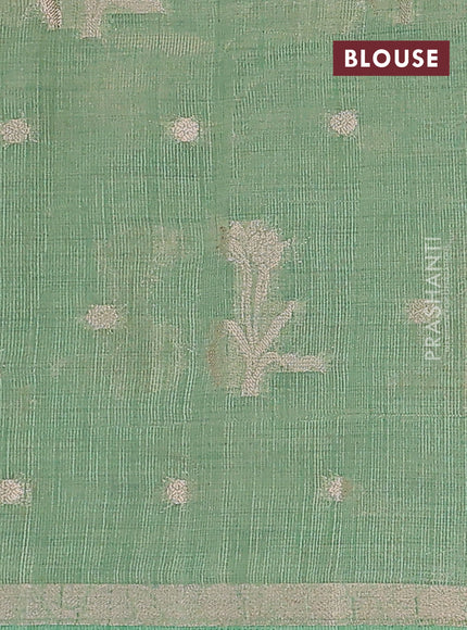 Semi raw silk saree teal green shade with zari woven floral buttas and small zari woven border