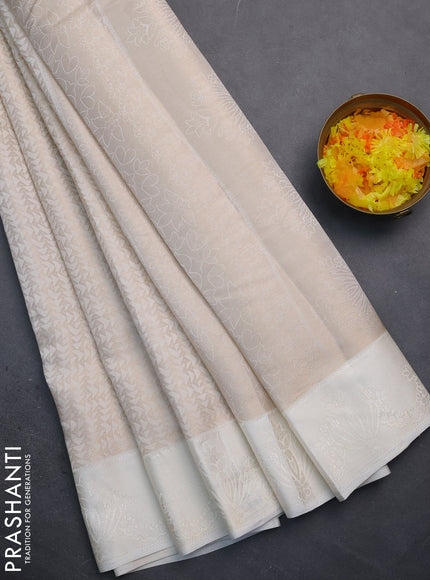 Semi raw silk saree off white with allover zari weaves and simple border