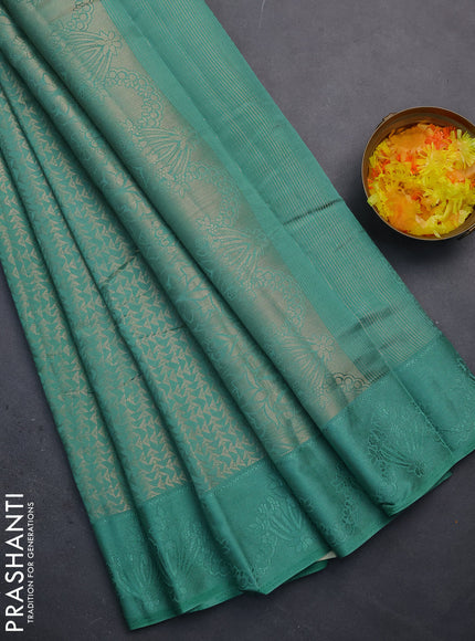 Semi raw silk saree teal green shade with allover zari weaves and simple border