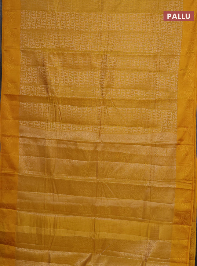 Semi raw silk saree mango yellow with allover zari weaves and simple border