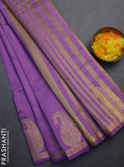 Semi raw silk saree lavender with plain body and paisley design zari woven butta border