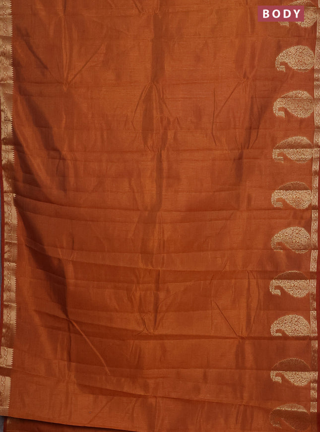 Semi raw silk saree rust shade with plain body and paisley design zari woven butta border
