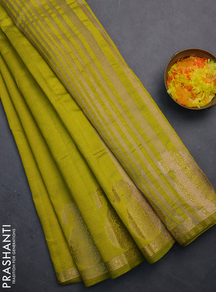 Semi raw silk saree lime green with plain body and paisley design zari woven butta border