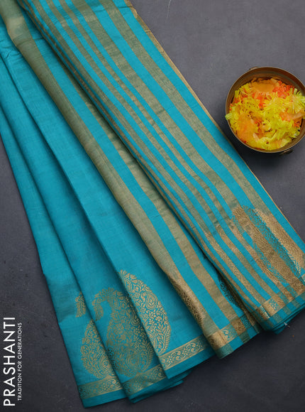 Semi raw silk saree teal shade with plain body and paisley design zari woven butta border