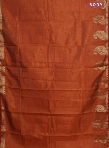 Semi raw silk saree rust shade with plain body and paisley design zari woven butta border